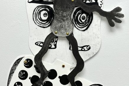Detail of paper puppet hand printed with linocut, stone lithography and drypoint on paper/brass fasteners, 2025